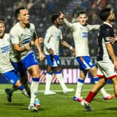 Rangers forward Lawrence Shankland wheels away to celebrate his second goal against Falkirk
