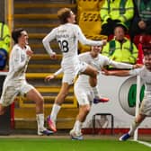 Ben Krauhaus wheels away to celebrate with his Falkirk team-mates after scoring the winner against Aberdeen