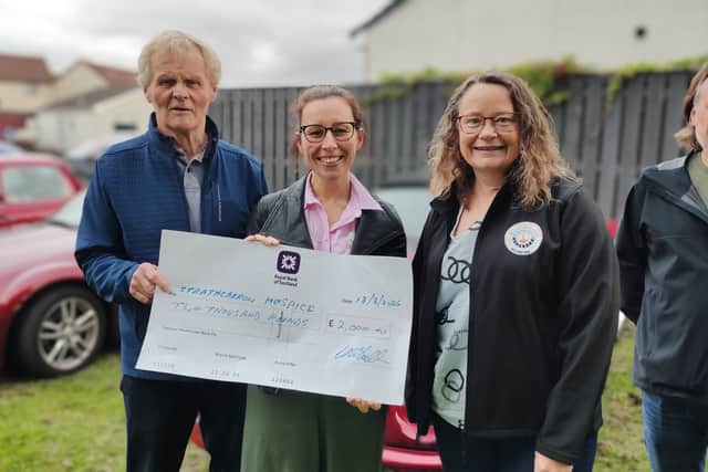 Presentation by Club Chairman George Waddell and Club Treasurer Lorna Brown to Strathcarron Hospice on 18 Aug