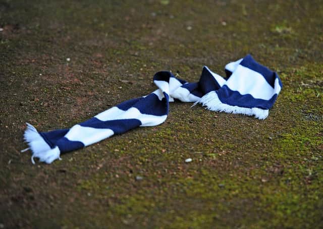 Falkirk scraf was thrown onto the track as the Bairns trudged off at the interval. Picture: Michael Gillen.