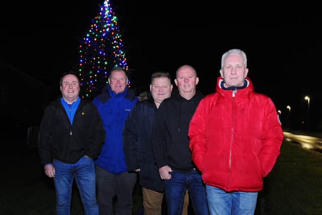 Carronshore Heritage Forum members were delighted with the number of people who turned out to see the village’s Christmas tree being switched on. Picture: Michael Gillen