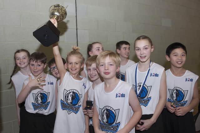 Captain Jay Bunyan lifts the Scottish Junior NBA trophy for St Margaret's. Picture Roberto Cavieres.