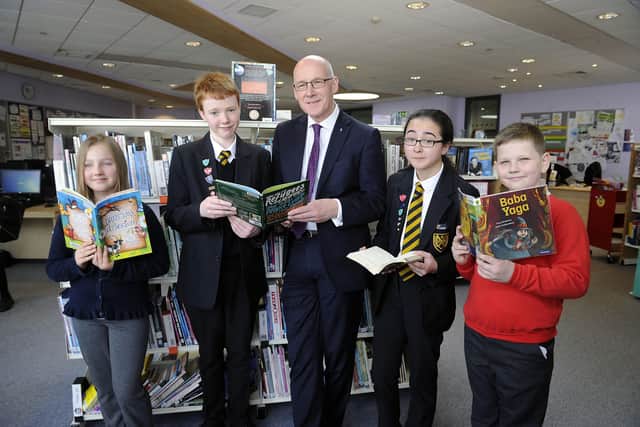 Deputy First Minister John Swinney meets with keen readers at Grangemouth High School
