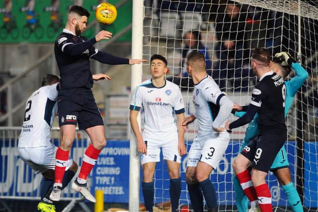 Mark Durnan rises to head home the third Falkirk goal (picture by Michael Gillen)