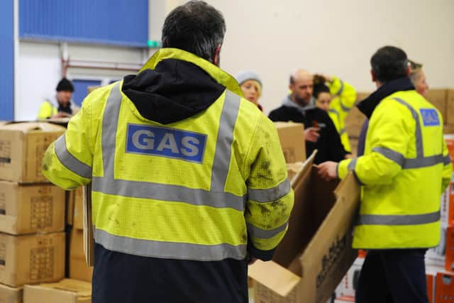 SGN with a multi-agency response including Police Scotland, Scottish Fire and Rescue, Falkirk Council and third sector volunteers are distributing twin electric cooker hobs and electric heaters to the most vulnerable in the affected areas. Picture: Michael Gillen