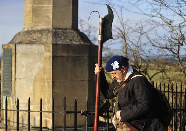 A historical re-enactor carrying a Lochaber axe ponders the slaughter which ensued when British and Jacobite armies collided on Falkirk Muir in 1746.