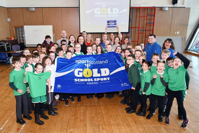 Steven Coulter sportscotland awarded the flag to St Margaret's. Picture: Michael Gillen.