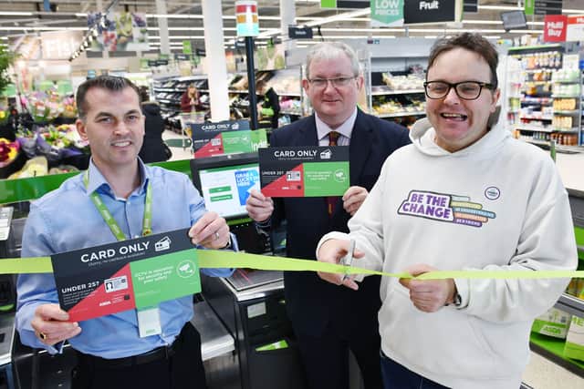 Kevin McPhee, Asda Grangemouth general store manager, Angus MacDonald MSP and David Allan, ENABLE Scotland Champion unveil the new checkouts