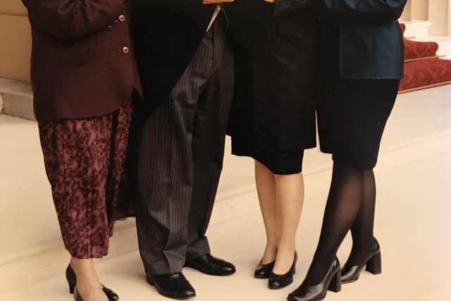 Dr Andrew Taylor receiving his OBE in 1999 at Buckingham Palace with (L to R) mother Jean Taylor (nee Dawson), wife Beth and daughter Naomi
