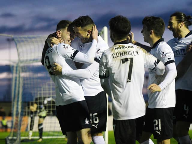 Players celebrate Declan McManus' hat-trick. Picture: Michael Gillen.