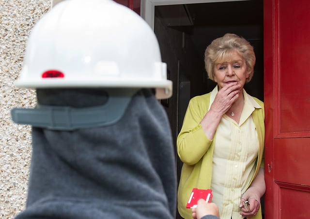 A bogus caller conned an elderly resident out of cash in Falkirk last week. Photo staged by actors.