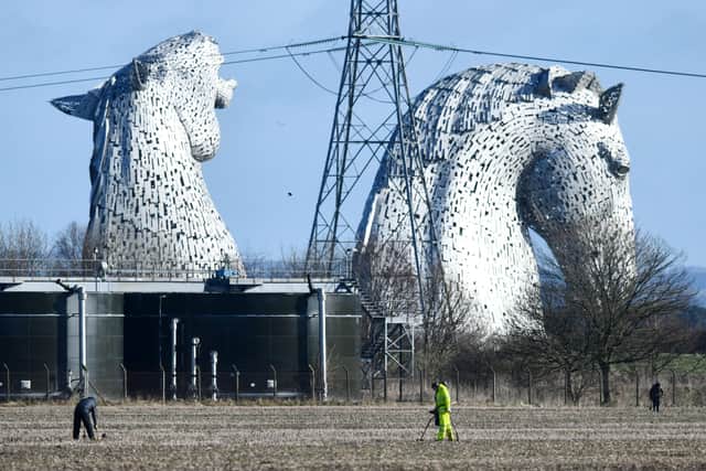 Metal detectorists spent time searching for hidden artefacts on farmland near The Kelpies. Picture: Michael Gillen