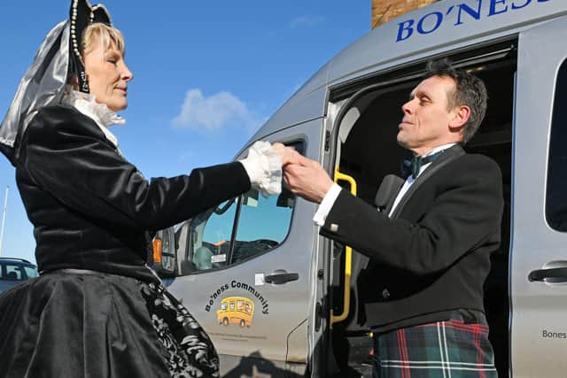 Mary Queen of Scots , aka Val Ferguson OBE, a trustee of Bo'ness Community Bus Association, boards the HippFest Community Bus (or more properly coach, given the context) at Linlithgow Palace, with the assistance of Andy Cannon - who will narrate the film at Hippfest.