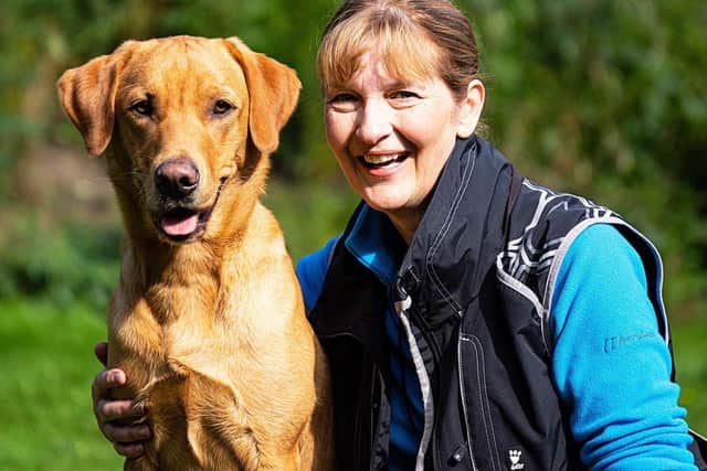 Falkirk dog trainer Sharon Deans with her Labrador Gus