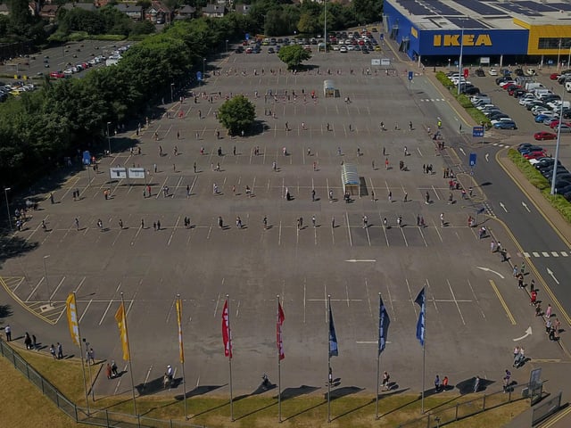 Aerial photos show hundreds of customers queuing around the block in the stifling heat to get into Ikea - as stores reopened for the first time since the coronavirus outbreak. Photos: SWNS