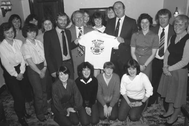 Neil Farnworth's way with words has proved a winner with Preston North End Ladies soccer team. For an article written by sports writer Neil has won a set of shirts for the ladies, currently favourites to win the Women's Football Association Cup. They gathered together at the Derby Arms, Inskip, to be presented with their new T-shirts and to thank Post man Farnworth. It was his report of the North End Ladies' last cup game that won the shirts for the team