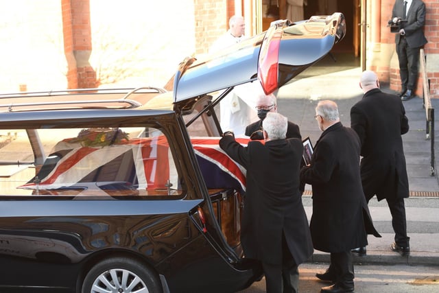 John's coffin arrives at St Robert's Church