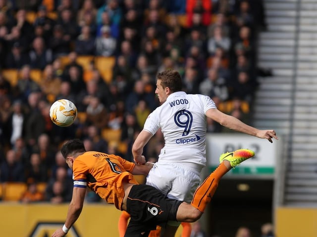 Striker Chris Wood rises high.
