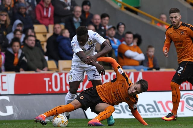 Ronaldo Viera is prevented from getting to the ball.