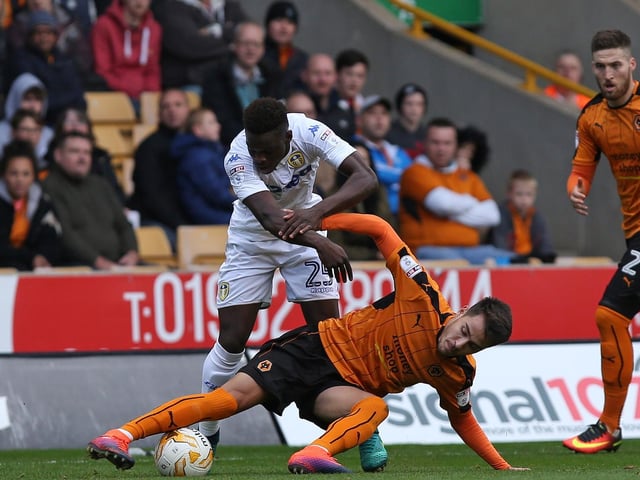 Ronaldo Viera is prevented from getting to the ball.
