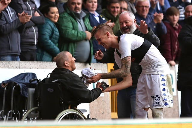 Pontus Jansson hands his shirt to a fan at full-time.