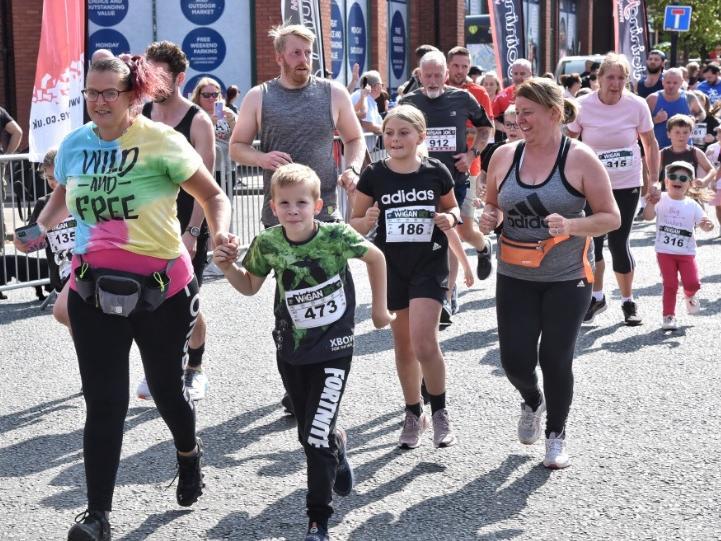 Runners and walkers enjoying the family mile