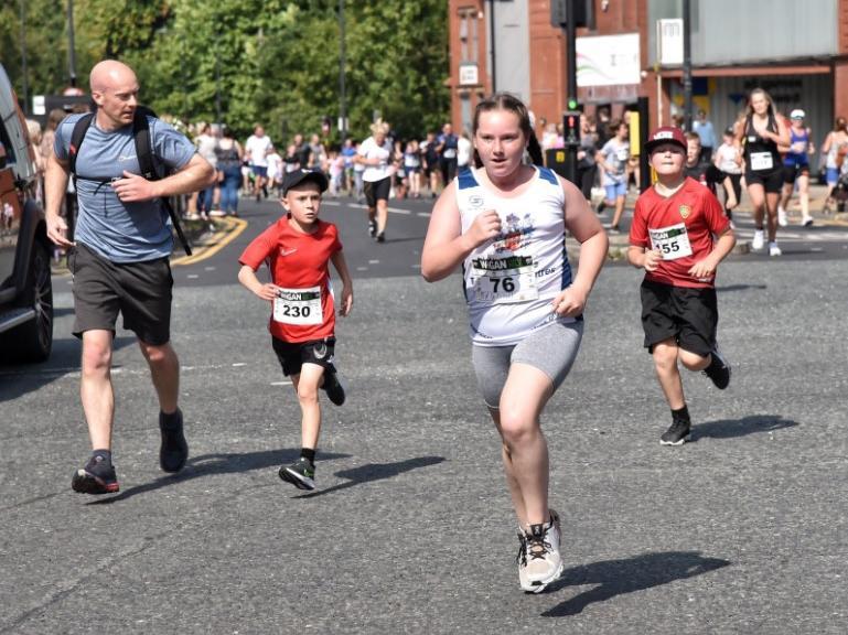 Runners and walkers enjoying the family mile