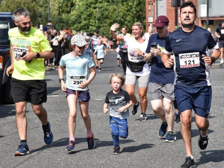 Runners and walkers enjoying the family mile