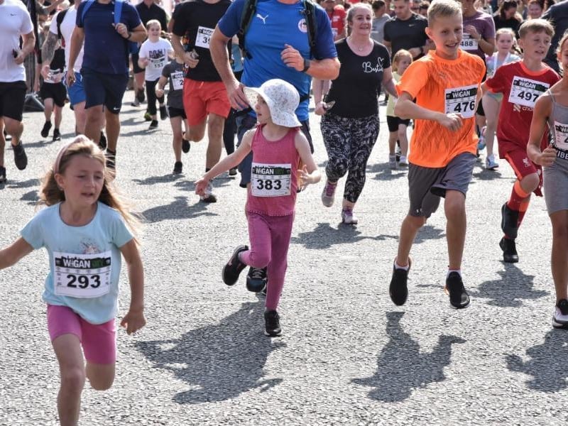 Runners and walkers enjoying the family mile