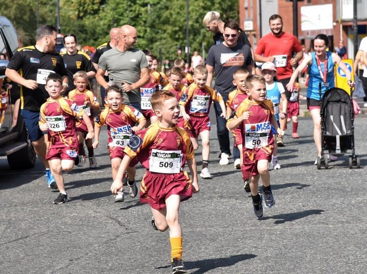 Runners and walkers enjoying the family mile