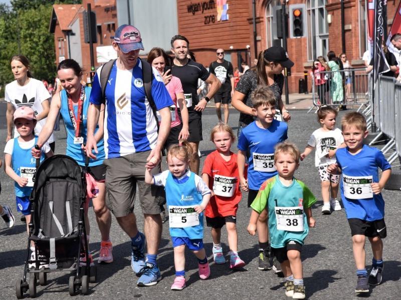 Runners and walkers enjoying the family mile