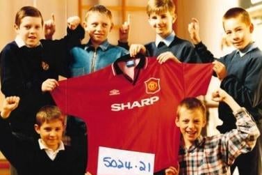 Netherton J and I School auction of a Manchester United football club shirt. Taken 1996.