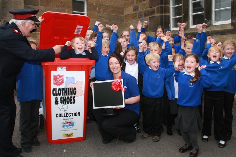 Pupils from Castleton School celebrate receiving their new computer.
