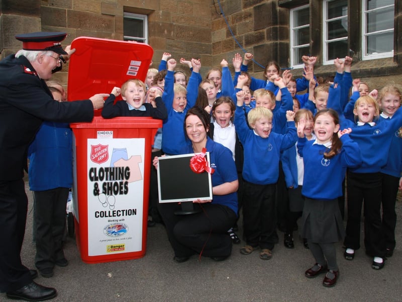 Pupils from Castleton School celebrate receiving their new computer.