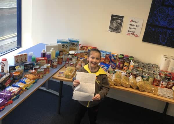 Hailey Whyte (7), from Carronshore, collected items to donate to Community Focus Scotland's food larder as she worked towards her charity badge at Brownies.