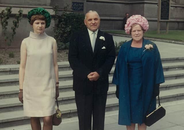 Moira, then aged around 17 or 18, with her mum and dad James and Christina Murray at a wedding in Dundee.