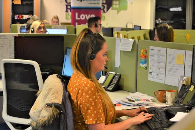Hard at work...staff are now answering calls at home, instead of the office.