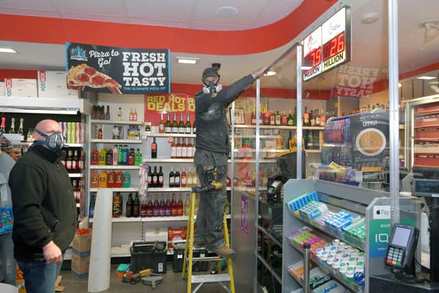 Ross Wilson, Steven Differ and their staff have been installing various COVID-19 protection measures, including at Best-one Redding Supermarket. Picture: Michael Gillen.