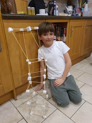 Cavan is pictured with his self-built badge project.