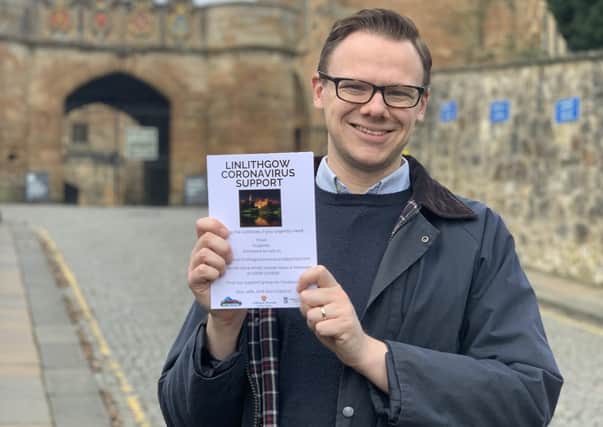 Rev Dr Liam Fraser of the Linlithgow Coronavvirus Support group, with the leaflet that has been put through every door in the town.