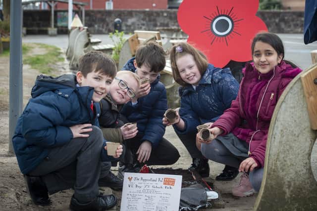 Getting their hands dirty....to help launch the VE Day 75 pack, prior to schools being closed. (Pic: Mark Owens/Poppyscotland).