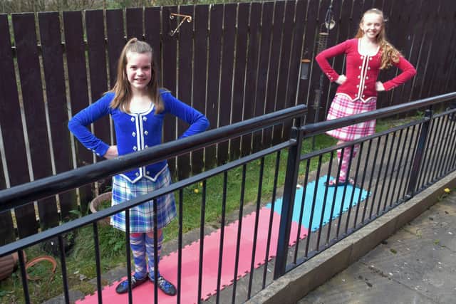 Anna Stoddart (11) and Lucy Forrest (13) of Claire Hammell School of Dance entertained Jean at the window.