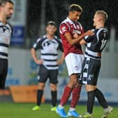 Games between the Shire and Kelty were close this season, as Nathan Austin and Bobby Barr get to grips. Picture: Michael Gillen.