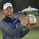 Bernd Wiesberger of Austria celebrates with the trophy following victory in the final round of the Aberdeen Standard Investments Scottish Open at The Renaissance Club. (Photo by Andrew Redington/Getty Images)
