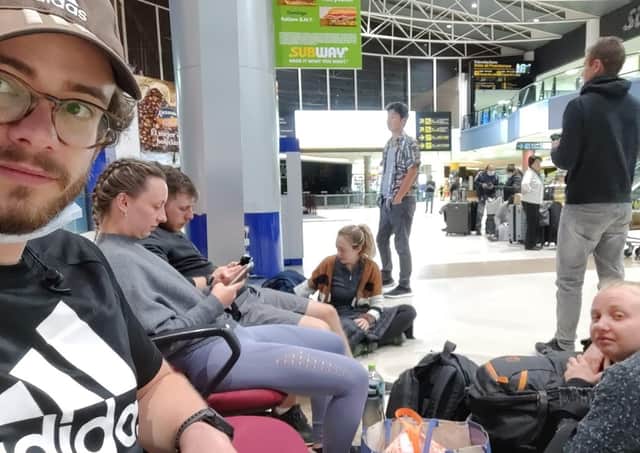 Kenneth, left, waiting for a plane from Bolivia to Chile.