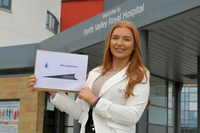 04-05-2020. Picture Michael Gillen. FALKIRK. Day 42 of UK wide coronavirus lockdown. Forth Valley Royal Hospital. Falkirk FC presenting player of the Month for April to local hero Erin Rooney 23 an ICU staff nurse at FVRH from Reddingmuirhead.
