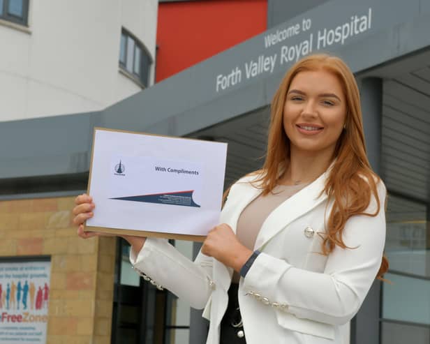 04-05-2020. Picture Michael Gillen. FALKIRK. Day 42 of UK wide coronavirus lockdown. Forth Valley Royal Hospital. Falkirk FC presenting player of the Month for April to local hero Erin Rooney 23 an ICU staff nurse at FVRH from Reddingmuirhead.