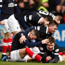 Falkirk swamp Paul Dixon after his late strike. Picture: Michael Gillen. MORE IN OUR PICTURE GALLERY