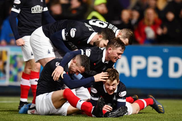 Falkirk swamp Paul Dixon after his late strike. Picture: Michael Gillen. MORE IN OUR PICTURE GALLERY