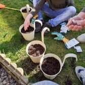 Josh Cupples gets to work on his gardening badge.